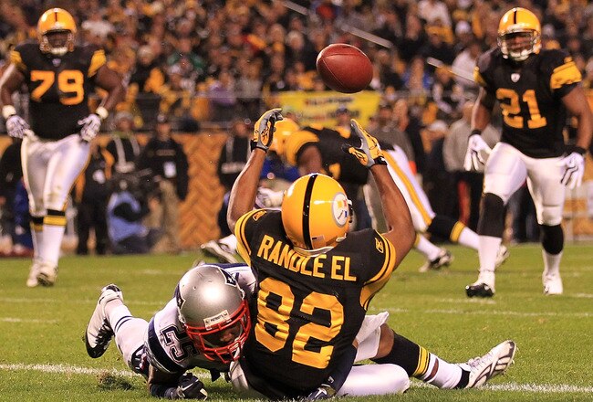 PITTSBURGH - NOVEMBER 14:  Antwaan Randle El #82 of the Pittsburgh Steelers fumbles a catch in the endzone under pressure from Patrick Chung #25 of the New England Patriots on November 14, 2010 at Heinz Field in Pittsburgh, Pennsylvania.  (Photo by Chris McGrath/Getty Images)