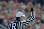 AUBURN, AL - NOVEMBER 06:  NCAA referee Ken Williamson signals the start of play as the Auburn Tigers play against the Chattanooga Mocs November 6, 2010 at Jordan-Hare Stadium in Auburn, Alabama.  (Photo by Al Messerschmidt/Getty Images)
