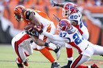 CINCINNATI - NOVEMBER 21:  Cedric Benson #32 of the Cincinnati Bengals is tackled by Jarius Byrd #31, Reggie Corner #27  and Donte Whitner #20 of the Buffalo Bills during the NFL game at Paul Brown Stadium on November 21, 2010 in Cincinnati, Ohio.  (Photo by Andy Lyons/Getty Images)