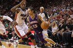 MIAMI - NOVEMBER 17:  Steve Nash #13  of the Phoenix Suns dribbles around Udonis Haslem #40 during a game against the  Miami Heat at American Airlines Arena on November 17, 2010 in Miami, Florida. NOTE TO USER: User expressly acknowledges and agrees that, by downloading and/or using this Photograph, User is consenting to the terms and conditions of the Getty Images License Agreement.  (Photo by Mike Ehrmann/Getty Images)