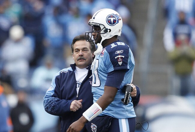 NASHVILLE, TN - DECEMBER 20: Head coach Jeff Fisher of the Tennessee Titans talks with Vince Young #10 after he threw a touchdown pass against the Miami Dolphins at LP Field on December 20, 2009 in Nashville, Tennessee. The Titans defeated the Dolphins 27-24 in overtime. (Photo by Joe Robbins/Getty Images)