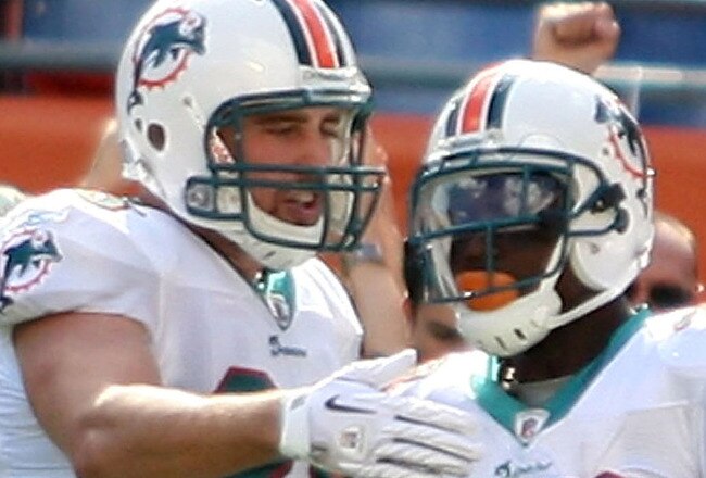 MIAMI - NOVEMBER 14:  Running Back Ronnie Brown #23 of the Miami Dolphins celebrates a touchdown with teammate Anthony Fasano #80 against the Tennessee Titans at Sun Life Stadium on November 14, 2010 in Miami, Florida.  (Photo by Marc Serota/Getty Images)