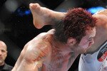 PORTLAND, OR - AUGUST 29:  UFC fighter Chris Leben (L) battles UFC fighter Jake Rosholt (R) during their Middleweight bout at UFC 102:  Couture vs. Nogueira at the Rose Garden Arena on August 29, 2009 in Portland, Oregon.  (Photo by Jon Kopaloff/Getty Images)
