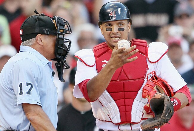 BOSTON - SEPTEMBER 05:  Victor Martinez #41 of the Boston Red Sox argues with John Hirshbeck #17 after Manny Ramirez of the Chicago White Sox was awarded first base on a hit by pitch call on September 5, 2010 at Fenway Park in Boston, Massachusetts.  (Photo by Elsa/Getty Images)