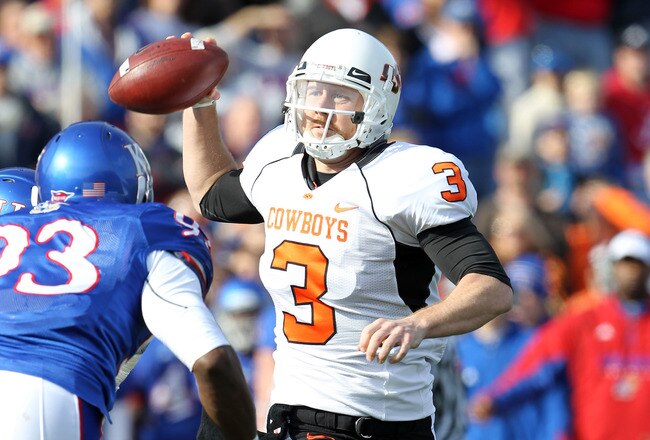 LAWRENCE, KS - NOVEMBER 20:  Quarterback Brandon Weeden #3 of the Oklahoma State Cowboys passes during the game against  the Kansas Jayhawks on November 20, 2010 at Memorial Stadium in Lawrence, Kansas.  (Photo by Jamie Squire/Getty Images)