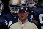 SOUTH BEND, IN - SEPTEMBER 11: Head coach Brian Kelly of the Notre Dame Fighting Irish waits to enter the field with his team including Carlo Calabrese #44 and Ethan Johnson #90 before a game against the Michigan Wolverines at Notre Dame Stadium on September 11, 2010 in South Bend, Indiana. Michigan defeated Notre Dame 28-24. (Photo by Jonathan Daniel/Getty Images)