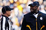 PITTSBURGH - NOVEMBER 21:  Head coach Mike Tomlin of the Pittsburgh Steelers argues with referees after a scrum took place in the middle of the field during the game against the Oakland Raiders on November 21, 2010 at Heinz Field in Pittsburgh, Pennsylvania.  (Photo by Jared Wickerham/Getty Images)