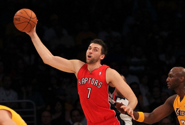 LOS ANGELES, CA - NOVEMBER 05:  Andrea Bargnani #1 of the Toronto Raptors controls the ball against Lamar Odom #7 of the Los Angeles Lakers at Staples Center on November 5, 2010 in Los Angeles, California.   NOTE TO USER: User expressly acknowledges and agrees that, by downloading and or using this photograph, User is consenting to the terms and conditions of the Getty Images License Agreement.  (Photo by Stephen Dunn/Getty Images)
