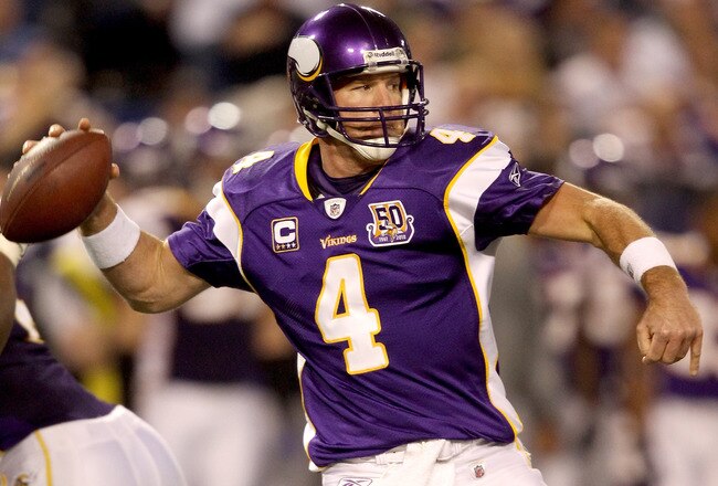 MINNEAPOLIS - NOVEMBER 21:  Quarterback Brett Favre #4 of the Minnesota Vikings looks for an open receiver while playing the Green Bay Packers at the Hubert H. Humphrey Metrodome on November 21, 2010 in Minneapolis, Minnesota.  (Photo by Matthew Stockman/Getty Images)