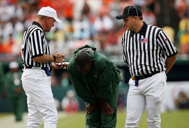 MIAMI - OCTOBER 04:  Head coach Randy Shannon of the Miami Hurricanes reacts after hearing an explanation of a call from referee Jack Childress, L, and field judge Mike Cullin while taking on the Florida State Seminoles at Dolphin Stadium on October 4, 2008 in Miami, Florida.  (Photo by Doug Benc/Getty Images)
