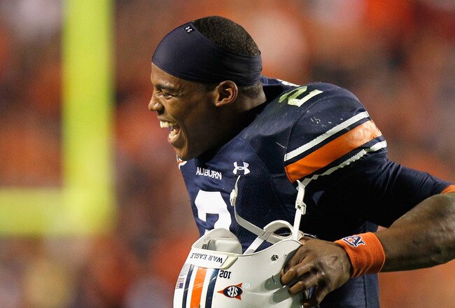 AUBURN, AL - NOVEMBER 13:  Quarterback Cameron Newton #2 of the Auburn Tigers celebrates after an official review showed Newton crossed the end zone after diving for a touchdown against the Georgia Bulldogs at Jordan-Hare Stadium on November 13, 2010 in Auburn, Alabama.  (Photo by Kevin C. Cox/Getty Images)