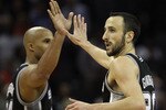 CHARLOTTE, NC - NOVEMBER 08:  Manu Ginobili #20 of the San Antonio Spurs celebrates with teammate Richard Jefferson #24 after making a basket late in the 4th quarter giving the Spurs a 95-91 victory over the Charlotte Bobcats during their game at Time Warner Cable Arena on November 8, 2010 in Charlotte, North Carolina.  NOTE TO USER: User expressly acknowledges and agrees that, by downloading and/or using this Photograph, User is consenting to the terms and conditions of the Getty Images License Agreement.  (Photo by Streeter Lecka/Getty Images)
