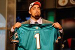 NEW YORK - APRIL 22:  Jared Odrick from Penn State holds up a Miami Dolphins jersey after the Dolphins selected Odrick number 28 overall during the first round of the 2010 NFL Draft at Radio City Music Hall on April 22, 2010 in New York City.  (Photo by Jeff Zelevansky/Getty Images)