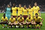 BRAGA, PORTUGAL - NOVEMBER 23:  Players of Arsenal (L to R) Emmanuel Eboue, Lukasz Fabianski,  Johan Djourou, Jack Wilshere, Sebastien Squillaci, Cesc Fabregas, Theo Walcott, Tomas Rosicky, Kieran Gibbs, Nicklas Bendtner and Denilson pose prior their the UEFA Champions League Group H match between SC Braga and Arsenal at Estadio Municipal de Braga on November 23, 2010 in Braga, Portugal.  SC Braga won the match 2-0.  (Photo by David Ramos/Getty Images)