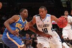 NEW YORK - NOVEMBER 24:  Corey Fisher #10 of the Villanova Wildcats drives past Lazeric Jones #11 of the UCLA Bruins during their preseason NIT semifinal at Madison Square Garden on November 24, 2010 in New York City.  (Photo by Nick Laham/Getty Images)