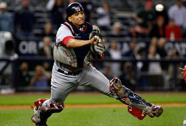 NEW YORK - SEPTEMBER 26:  Victor Martinez #41 of the Boston Red Sox throws the ball away for an error on Brett Gardner (not shown) of the New York Yankees bunt attempt in the 10th inning on September 26, 2010 at Yankee Stadium in the Bronx borough of New York City. The Yankees won 4-3.  (Photo by Mike Stobe/Getty Images)