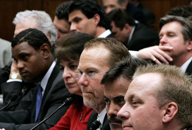 WASHINGTON - MARCH 17:  Former Oakland Athletics and Texas Rangers player Jose Canseco (C, top) listens to testimony March 17, 2005 for a House Committee session that is investigating Major League Baseball efforts to eradicate steroid use in Washington, DC.  (L-R) Baltimore Orioles Sammy Sosa, Sosa's translator Patricia Rosell, former St. Louis Cardinals Mark McGwire, Baltimore Orioles Rafael Palmeiro, and Boston Red Sox pitcher Curt Schilling listen as well. Major League Baseball (MLB) Commissioner Allan 'Bud' Selig will give testimony regarding MLB?s efforts to eradicate steriod usage among its players.  (Photo by Win McNamee/Getty Images)