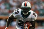 MIAMI - OCTOBER 25:  Running back Ronnie Brown #23 of the Miami Dolphins looks for room to run against the New Orleans Saints at Land Shark Stadium on October 25, 2009 in Miami, Florida.  (Photo by Doug Benc/Getty Images)
