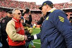 COLUMBUS, OH - NOVEMBER 27:  Head Coach Jim Tressel of the Ohio State Buckeyes shakes hands with Head Coach Rich Rodriguez after the Buckeyes defeated the Wolverines 37-7 at Ohio Stadium on November 27, 2010 in Columbus, Ohio.  (Photo by Jamie Sabau/Getty Images)