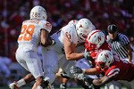 LINCOLN, NE - OCTOBER 16: Linebacker Lavonte David #4 and defensive tackle Jared Crick #94 of the Nebraska Cornhuskers attempt to get their hands on running back Foswhitt Whittaker #28 of the Texas Longhorns during first half action of their game at Memorial Stadium on October 16, 2010 in Lincoln, Nebraska. Texas Defeated Nebraska 20-13. (Photo by Eric Francis/Getty Images)