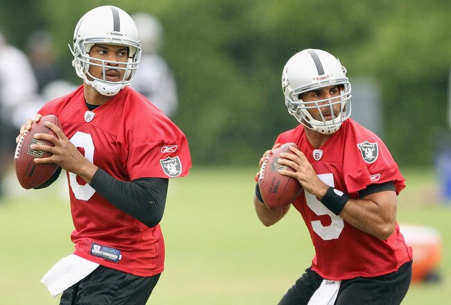 NAPA, CA - AUGUST 01:  Jason Campbell #8 and Bruce Gradkowski #5 of the Oakland Raiders work out during the Raiders training camp at their Napa Valley Training Complex on August 1, 2010 in Napa, California.  (Photo by Ezra Shaw/Getty Images)