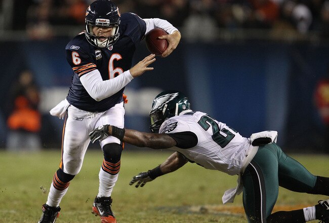 CHICAGO - NOVEMBER 28: Jay Cutler #6 of the Chicago Bears breaks away from Quintin Mikell #27 of the Philadelphia Eagles at Soldier Field on November 28, 2010 in Chicago, Illinois. The Bears defeated the Eagles 31-26. (Photo by Jonathan Daniel/Getty Images)
