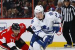 OTTAWA, ON - NOVEMBER 27:  Nick Foligno #71 of the Ottawa Senators pokes the puck away from Tyler Bozak #42 of the Toronto Maple Leafs in a game at Scotiabank Place on November 27, 2010 in Ottawa, Ontario, Canada.  (Photo by Phillip MacCallum/Getty Images)