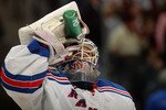 DENVER - NOVEMBER 19:  Goalie Henrik Lundqvist #30 of the New York Rangers takes a drink during a break in the action against the Colorado Avalanche go five hole for a second period goal at the Pepsi Center on November 19, 2010 in Denver, Colorado.  (Photo by Doug Pensinger/Getty Images)