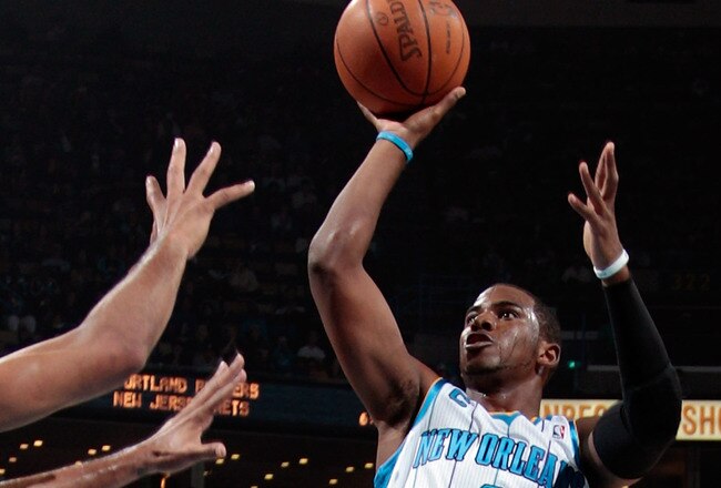 NEW ORLEANS - NOVEMBER 28:  Chris Paul #3 of the New Orleans Hornets shoots the ball over Tim Duncan #21 of the San Antonio Spurs at the New Orleans Arena on November 28, 2010 in New Orleans, Louisiana.  NOTE TO USER: User expressly acknowledges and agrees that, by downloading and/or using this photograph, User is consenting to the terms and conditions of the Getty Images License Agreement.  (Photo by Chris Graythen/Getty Images)