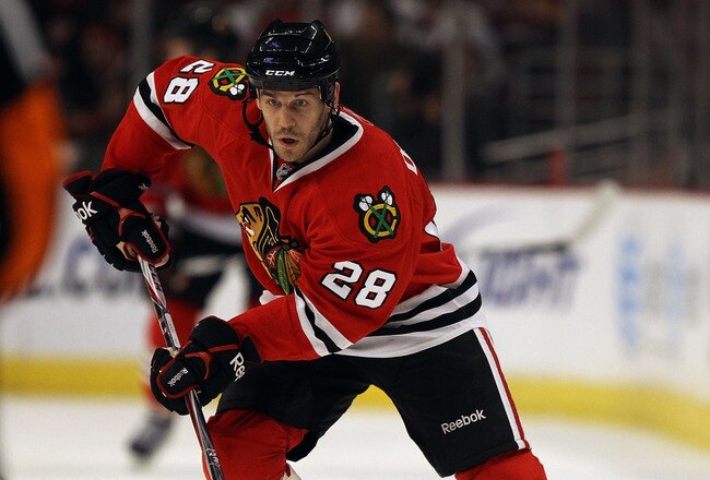 CHICAGO - NOVEMBER 03: Jake Dowell #28 of the Chicago Blackhawks skates up the ice against the New Jersey Devils at the United Center on November 3, 2010 in Chicago, Illinois. The Devils defeated the Blackhawks 5-3. (Photo by Jonathan Daniel/Getty Images)