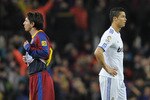 BARCELONA, SPAIN - NOVEMBER 29:  Cristiano Ronaldo of Real Madrid (R) and Lionel Messi of FC Barcelona look on during the La Liga match between Barcelona and Real Madrid at the Camp Nou Stadium on November 29, 2010 in Barcelona, Spain.  Barcelona won the match 5-0.  (Photo by David Ramos/Getty Images)