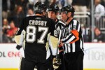 PITTSBURGH - NOVEMBER 19:  Sidney Crosby #87 of the Pittsburgh Penguins talks with officials Tony Sericolo #84 and Greg Kimmerly #18 during a game against the Carolina Hurricanes on November 19, 2010 at Consol Energy Center in Pittsburgh, Pennsylvania.  (Photo by Jamie Sabau/Getty Images)