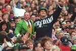 2 Nov 1996:  The University of Notre Dame Leprechaun mascot celebrates with a fan in the crowd during the Fighting Irish 54-27 Shamrock Classic win over Navy in Dublin, Ireland. Mandatory Credit: Billy Stickland/ALLSPORT