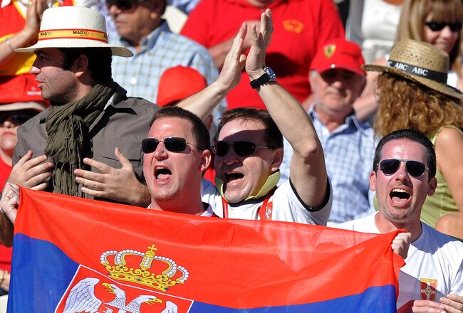 BENIDORM, SPAIN - MARCH 08:  Serbian fans cheer for Novak Djokovic during his match against Rafael Nadal of Spain on day two of the Davis Cup World Group first round tie between Spain and Serbia at the Parque Tematico Terra Mitica on March 8, 2009 in Benidorm, Spain. Nadal defeated Djokovic in three straight sets 6-4, 6-4 and 6-1 sending Spain into the Davis Cup quarter-finals with a 3-1 win over Serbia.  (Photo by Jasper Juinen/Getty Images)