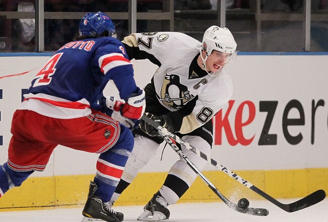 NEW YORK, NY - NOVEMBER 29:  Sidney Crosby #87 of the Pittsburgh Penguins is challenged by Michael Del Zotto #4 of the New York Rangers during their game on November 29, 2010 at Madison Square Garden in New York City.  (Photo by Chris McGrath/Getty Images)