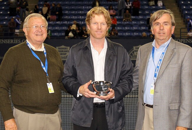 LOS ANGELES, CA - JULY 26:  (L-R) Former USTA President Franklin Johnson, former professional tennis player Jim Courier and tournament director Bob Kramer pose after Courier was introduced as the Farmers Classic, presented by Merceds-Benz, tournament honoree at the Los Angeles Tennis Center - UCLA on July 26, 2010 in Los Angeles, California.  (Photo by Jeff Gross/Getty Images)