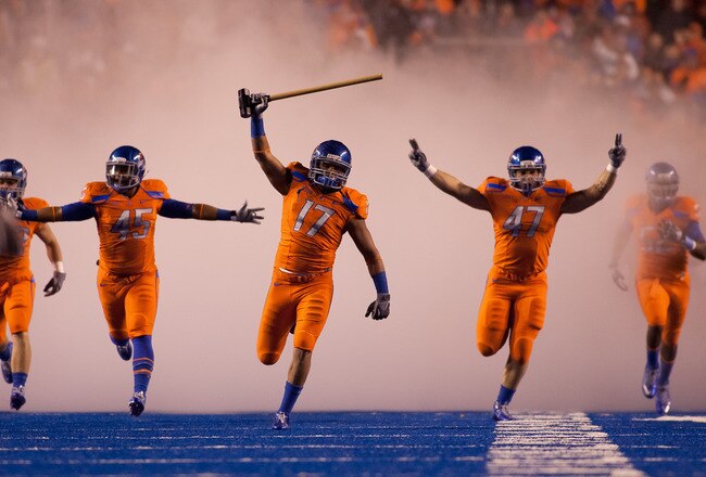 BOISE, ID - NOVEMBER 19:  Winston Venable #17 leads the Boise State Broncos onto the field before their game against the Fresno State Bulldogs at Bronco Stadium on November 19, 2010 in Boise, Idaho.  (Photo by Otto Kitsinger III/Getty Images)