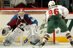 DENVER - APRIL 06:  Goalkeeper Jose Theodore #60 of the Colorado Avalanche prepares to make a save on a shot by Pierre-Marc Bouchard #96  the Minnesota Wild on the final shot of the shootout at the Pepsi Center on April 6, 2008 in Denver, Colorado.   (Photo by Doug Pensinger/Getty Images)