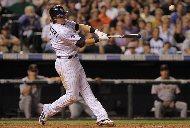 DENVER - SEPTEMBER 25:  Troy Tulowitzki #2 of the Colorado Rockies hits a two run homerun to give the Rockies a 5-4 lead over the San Francisco Giants in the fifth inning at Coors Field on September 25, 2010 in Denver, Colorado.  (Photo by Doug Pensinger/Getty Images)