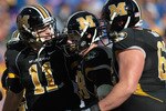 KANSAS CITY, MO - NOVEMBER 27:  Quarterback Blaine Gabbert #11 of the Missouri Tigers congratulates receiver T.J. Moe #28 after a touchdown during the game against the Kansas Jayhawks on November 27, 2010 at Arrowhead Stadium in Kansas City, Missouri.  (Photo by Jamie Squire/Getty Images)