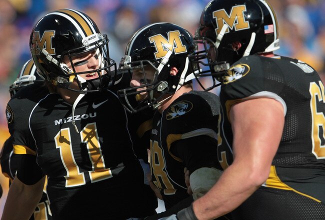 KANSAS CITY, MO - NOVEMBER 27:  Quarterback Blaine Gabbert #11 of the Missouri Tigers congratulates receiver T.J. Moe #28 after a touchdown during the game against the Kansas Jayhawks on November 27, 2010 at Arrowhead Stadium in Kansas City, Missouri.  (Photo by Jamie Squire/Getty Images)