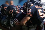 CHICAGO - OCTOBER 17: Justin Forsett #20 of the Seattle Seahawks is tackled by (L-R) Pia Tinoisamoa #59, Julius Peppers #90 and Brian Urlacher #54 of the Chicago Bears at Soldier Field on October 17, 2010 in Chicago, Illinois. The Seahawks defeated the Bears 23-20. (Photo by Jonathan Daniel/Getty Images)