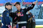 FORT WORTH, TX - NOVEMBER 05:  Kasey Kahne (L), driver of the #83 Red Bull Toyota, speaks with teammate Scott Speed, driver of the #82 Red Bull Toyota, on the grid during qualifying for the NASCAR Sprint Cup Series AAA Texas 500 at Texas Motor Speedway on November 5, 2010 in Fort Worth, Texas.  (Photo by Robert Laberge/Getty Images for NASCAR)