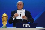 ZURICH, SWITZERLAND - DECEMBER 02: FIFA President Joseph S Blatter names Qatar as the winning hosts of 2022 duirng the FIFA World Cup 2018 & 2022 Host Countries Announcement at the Messe Conference Centre on December 2, 2010 in Zurich, Switzerland.  (Photo by Laurence Griffiths/Getty Images)