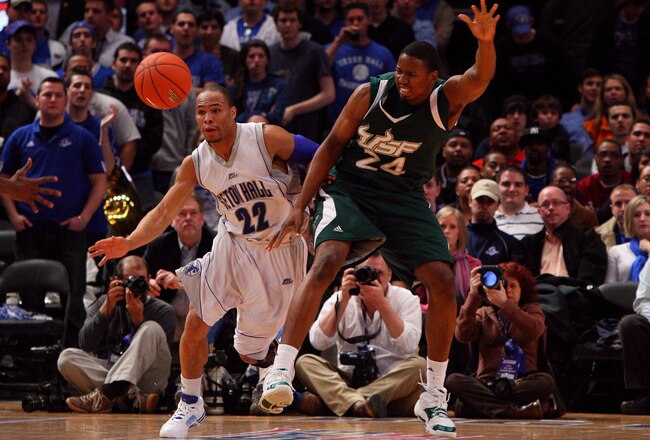 NEW YORK - MARCH 10:  Paul Gause #22 of the Seton Hall Pirates fights for a loose ball against Augustus Gilchrist #24 of the USF Bulls during the first round of the Big East Tournament at Madison Square Garden on March 10, 2009 in New York City.  (Photo by Jim McIsaac/Getty Images)