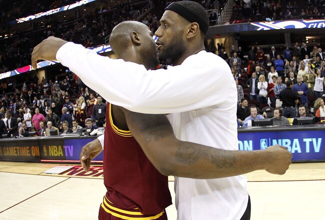 CLEVELAND, OH - DECEMBER 02:  LeBron James #6 of the Miami Heat hugs Jawad Williams after a 118-90 victory over the Cleveland Cavaliers at Quicken Loans Arena on December 2, 2010 in Cleveland, Ohio. NOTE TO USER: User expressly acknowledges and agrees that, by downloading and or using this photograph, User is consenting to the terms and conditions of the Getty Images License Agreement.  (Photo by Gregory Shamus/Getty Images)