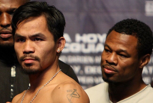 LAS VEGAS - DECEMBER 05:  (L-R) Oscar De La Hoya and Manny Pacquiao of the Philippines pose during the weigh-in for their welterweight fight at the MGM Grand Garden Arena December 5, 2008 in Las Vegas, Nevada. De La Hoya fights Pacquiao December 6th.  (Photo by Jed Jacobsohn/Getty Images)