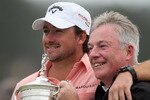 PEBBLE BEACH, CA - JUNE 20:  Graeme McDowell (L) of Northern Ireland celebrates with the trophy alongside his father Ken on the 18th green after winning the 110th U.S. Open at Pebble Beach Golf Links on June 20, 2010 in Pebble Beach, California.  (Photo by Jeff Gross/Getty Images)