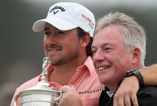 PEBBLE BEACH, CA - JUNE 20:  Graeme McDowell (L) of Northern Ireland celebrates with the trophy alongside his father Ken on the 18th green after winning the 110th U.S. Open at Pebble Beach Golf Links on June 20, 2010 in Pebble Beach, California.  (Photo by Jeff Gross/Getty Images)