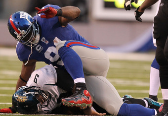 EAST RUTHERFORD, NJ - NOVEMBER 28:  Justin Tuck #91 of the New York Giants sacks David Garrard #9 of the Jacksonville Jaguars during their game on November 28, 2010 at The New Meadowlands Stadium in East Rutherford, New Jersey.  (Photo by Al Bello/Getty Images)